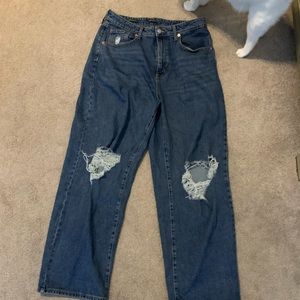 cat not included, blue denium, ripped at the knee